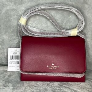 Very cute NWT cranberry leather compact wallet purse. Kate Spade.